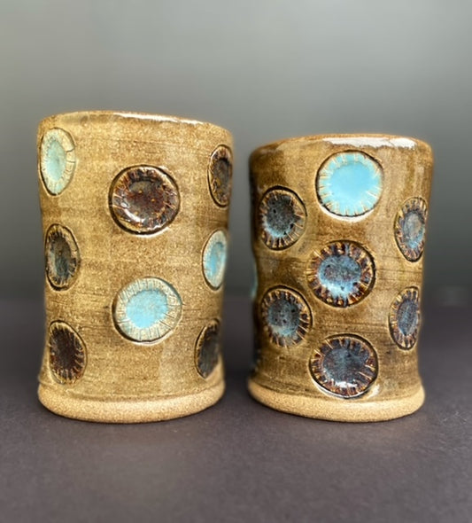 pair of cups with circles