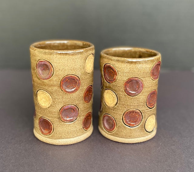 pair of cups with circles