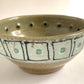 pair of small bowls with squares