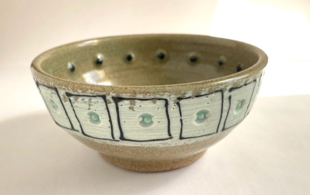 pair of small bowls with squares