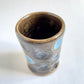 pair of cups with circles